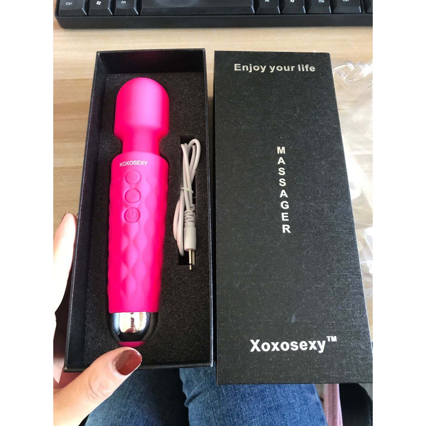 Someone holding the open box of the Pink Wand Massager Vibrator showing how nice it is.